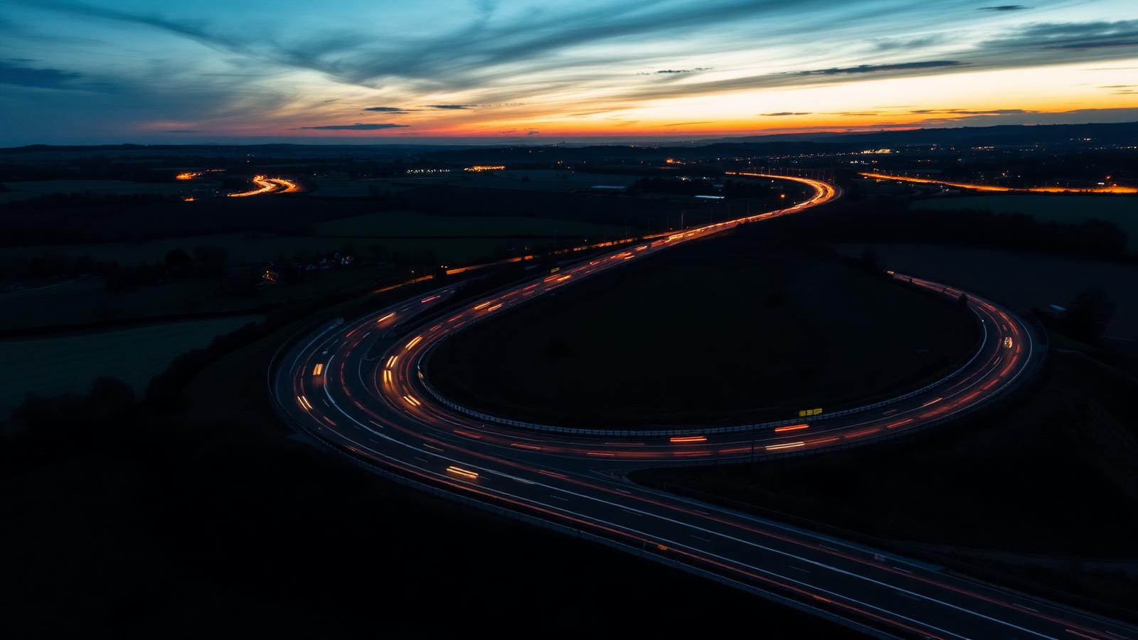 UK motorway at twilight with car light streaks